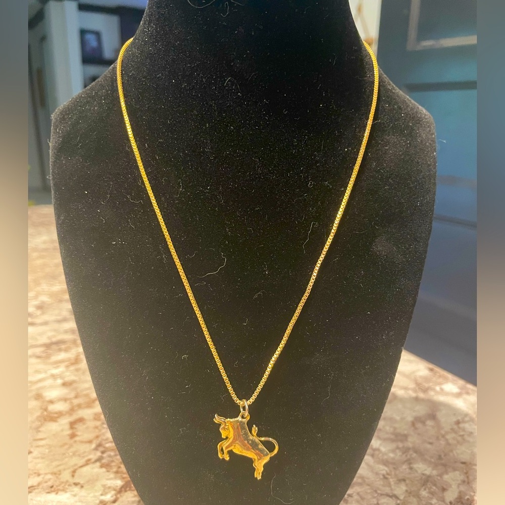 Elegant Gold Necklace with Bull Pendant